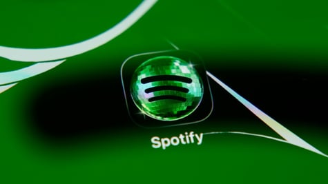 spotify app green logo, green background, three black stripes, disco ball-like reflective