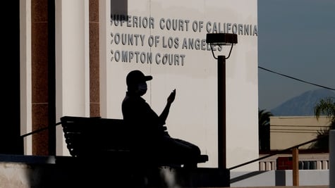 The Superior Court of California County building, man shadow on bench, lighthing poll