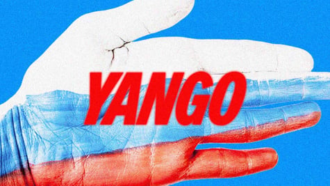 A hand covered in Russian flag colors holding Yango logo
