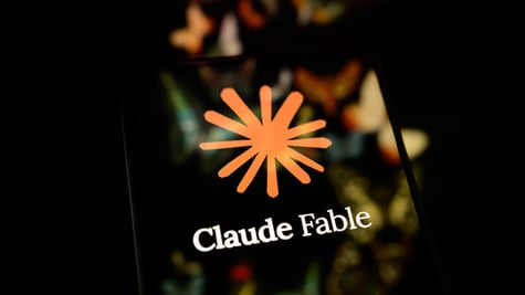 claude fable logo reflected on a black smartphone screen, orange