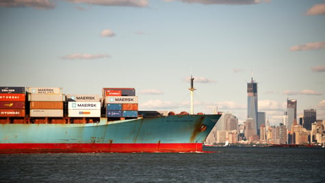 Cargo shipping NYC skyline