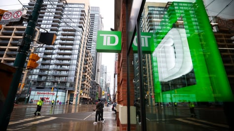 Toronto Dominion Bank logo, green background, white D, tall glass buildings, green reflection