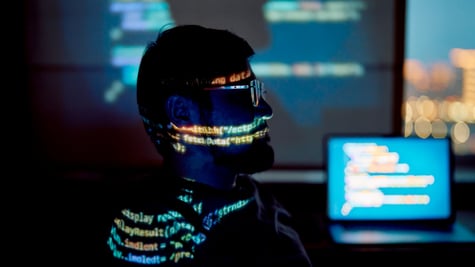 man with beard and moustache, profile, glowing code all over his face and shoulder line