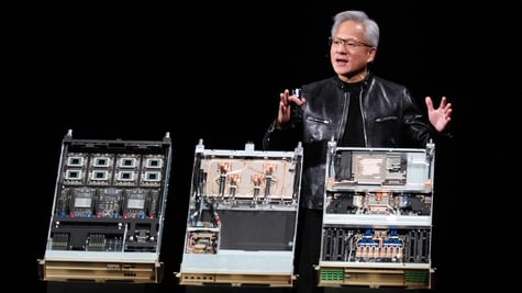 jensen huang, black leather jacket, black stage, three open pc desktop computers, grey hair