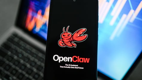 openclaw logo, red lobster, black smartphone screen, laptop keyboard