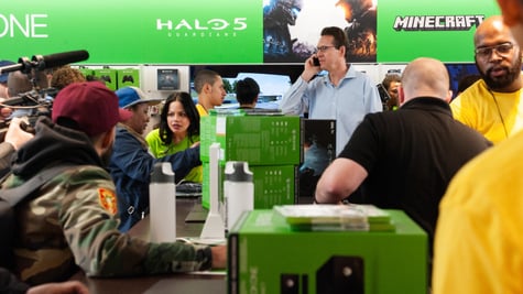 People in store buying Xbox
