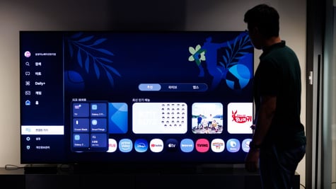 Samsung smart TV with a person in the background