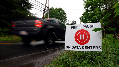 Signs against data centers line Lockhouse Road,