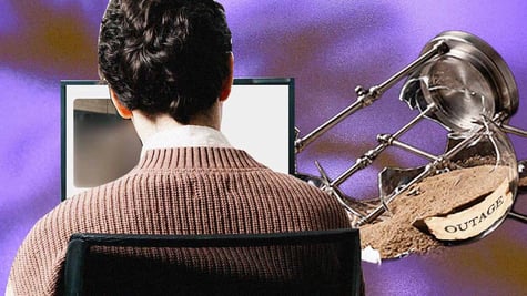 A stressed office worker stares at a frozen ChatGPT
