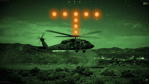 A helicopter with orange orbs flashing nearby.