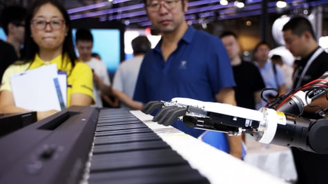 black humanoid hand fingers play piano, asian man in blue shirt, asian woman, black hair, yellow top