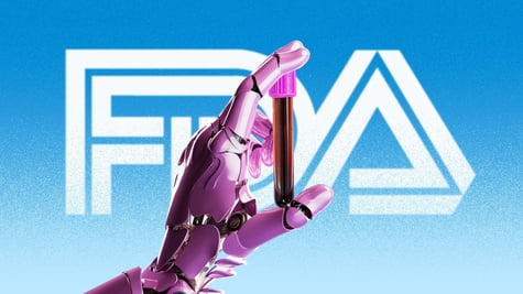 A robot's hand holds a blood collection tube