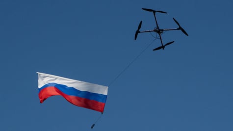 A drone carrying the Russian flag