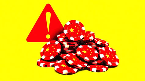 Casino chips and a red exclamation sign.