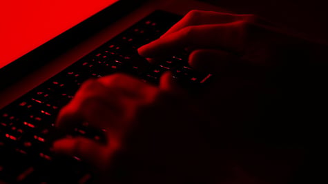 fingers on a laptop keyboard