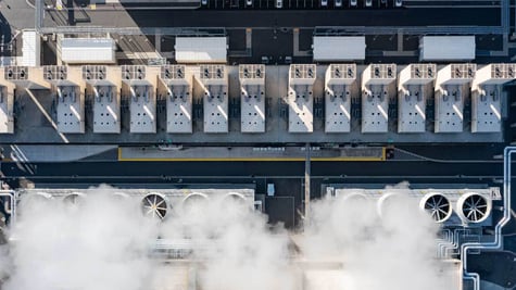 Aerial drone view of a large hyperscale data center cooling system with massive industrial fans