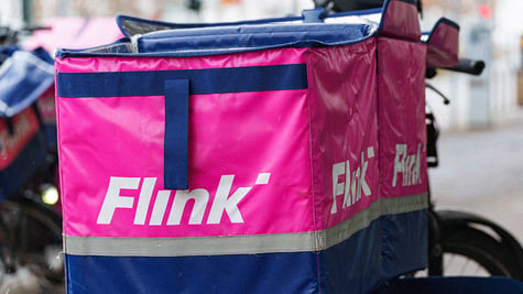 Flink bag with ompany logo visible, fixed on a bike