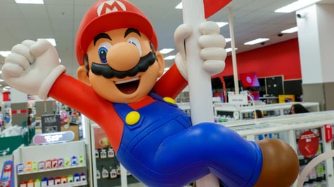super mario on white poll, blue pants, red top, white man, brown moustache, red hat, big nose