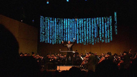 A conductor bringing about software code. Image by Cybernews.