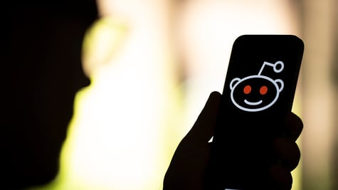 The Reddit logo is seen in this photo illustration
