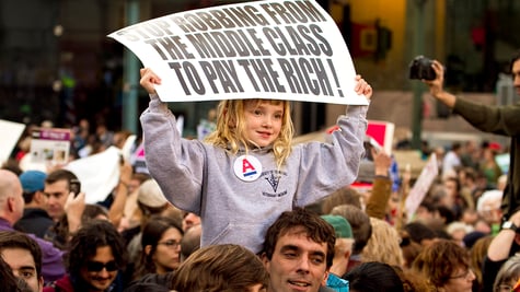 A young girl protesting for a better future in Foley Square, 2012.