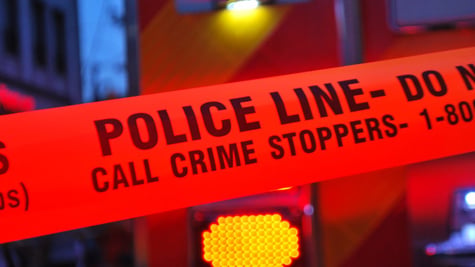 Crime Stoppers written on red police tape