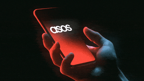 Smartphone displaying ASOS hack notification.