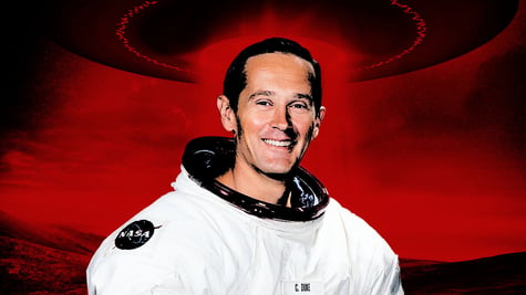 Former NASA astronaut Charlie Duke, with a celestial light glowing from a UFO.