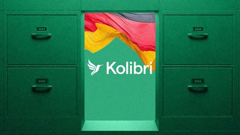 The logo of Kolibri and German flag between 2 green cabinets with drawers