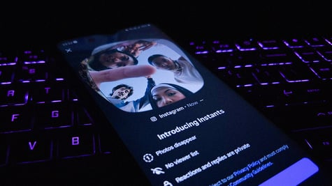 A phone screen with an Instagram Instants presentation on it.