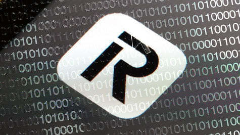 Revolut logo in the grey background with binary code