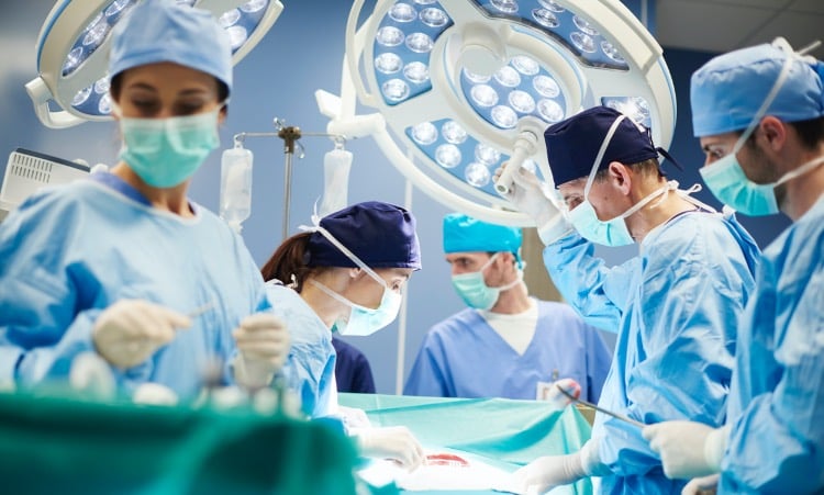 Group of surgeons in operating room