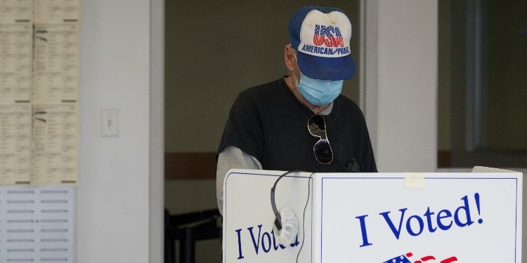 A person casts a ballot for the upcoming presidential election during early voting in Sumter, South 