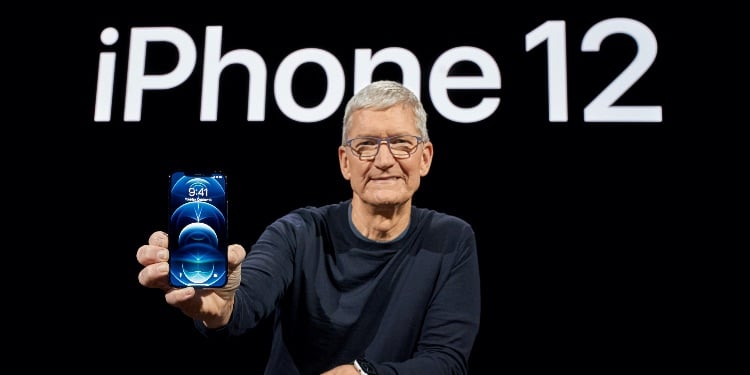 Apple CEO Tim Cook poses with the all-new iPhone 12 Pro at Apple Park in Cupertino, California