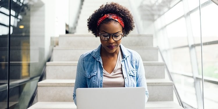 woman studying cybersecurity materials