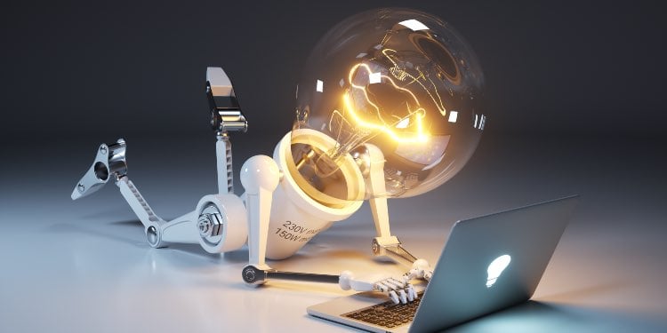 Light bulb as robot lying and using pc