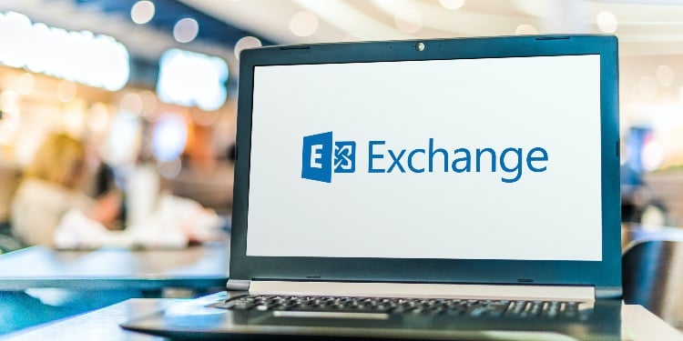 Laptop computer displaying logo of Microsoft Exchange, a mail server and calendaring server develope