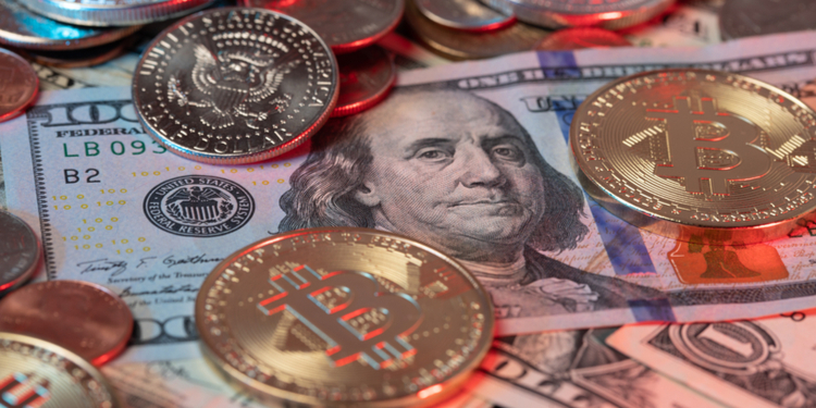 Bitcoin Coins on top of US Dollar Banknotes and Dollar coins in the background