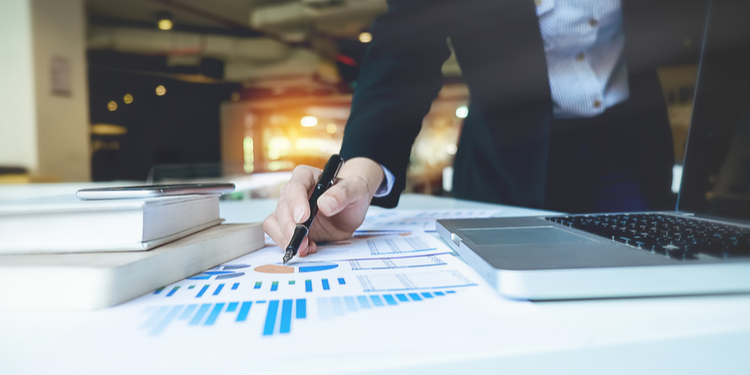Business woman pointing to business documents