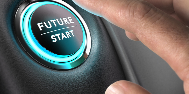 Finger reaching for Future/Start button in a car. Automotive industry breakout