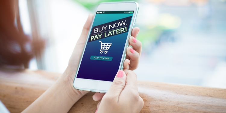 Female hands holding mobile with buy now pay later on screen