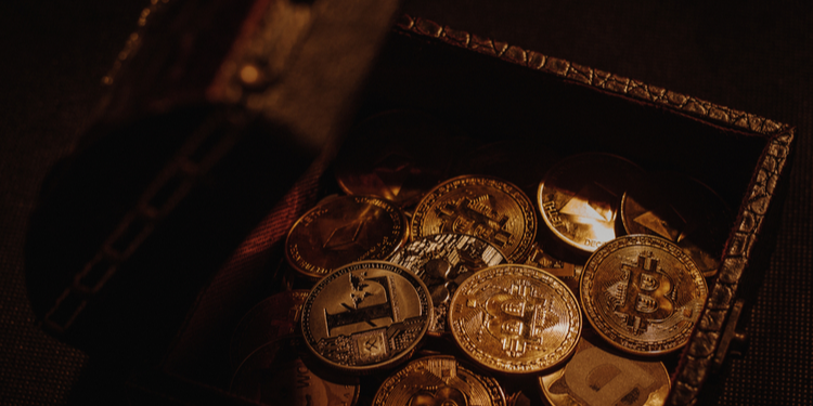 Chest in shadowy light with Bitcoins spilling from it