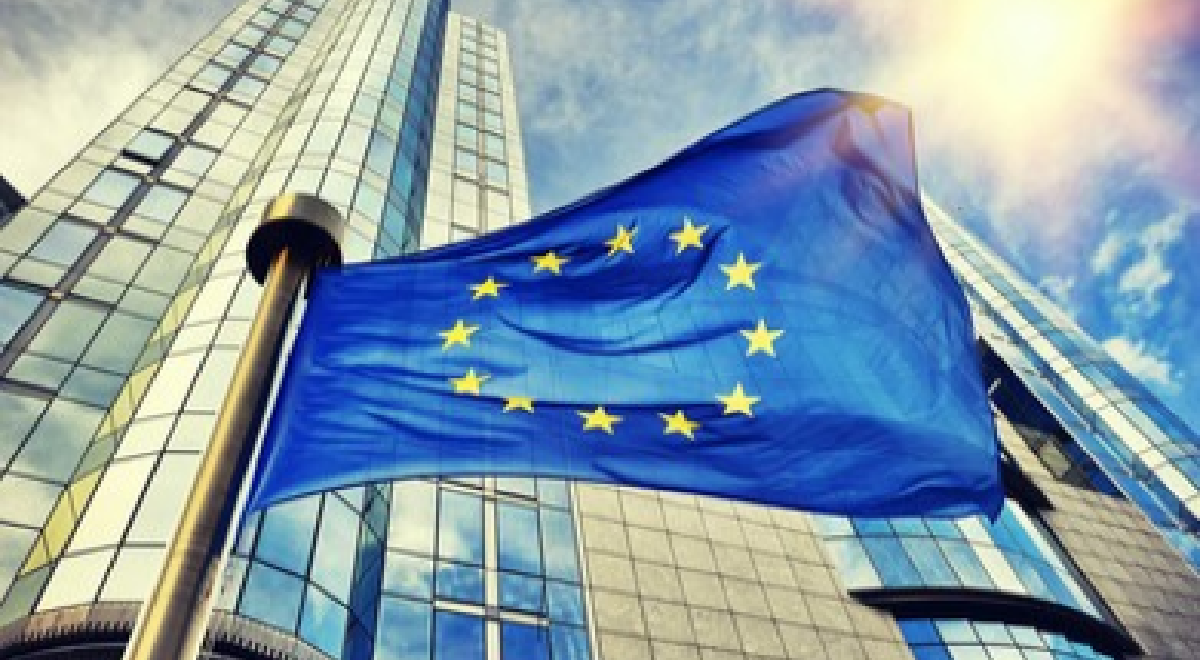 Looming building with EU flag in foreground