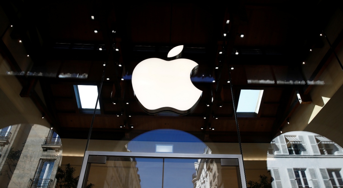 white shiny apple logo surrounded by dark glass