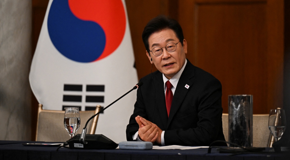 south korean president in black suit and white shirt