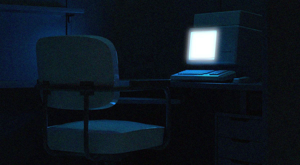 An empty chair in front of a desk with a laptop