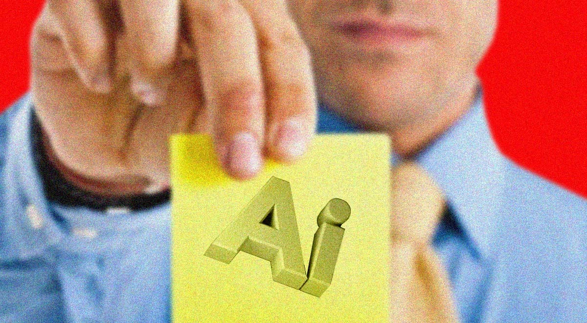 An office worker holds a sticky note that says AI
