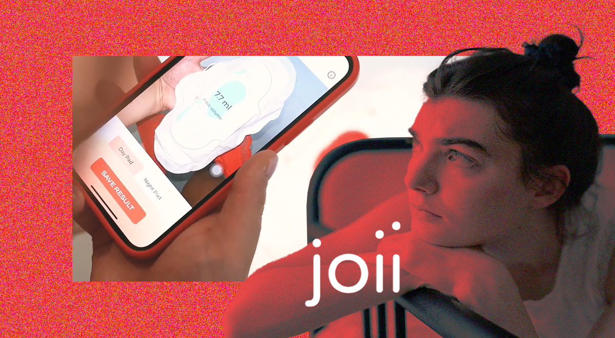 A woman looking at Joii period app on her phone