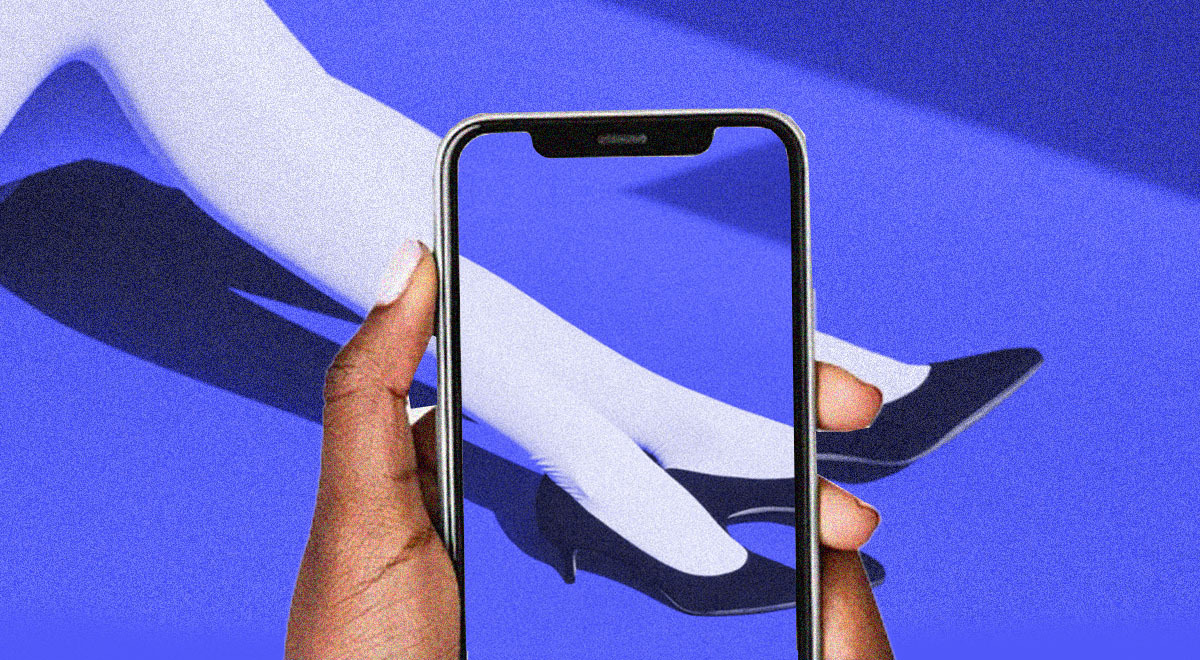 A phone taking a photo of elegant legs.