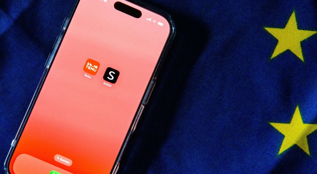Temu and Shein apps on an iPhone screen with EU flag in the background